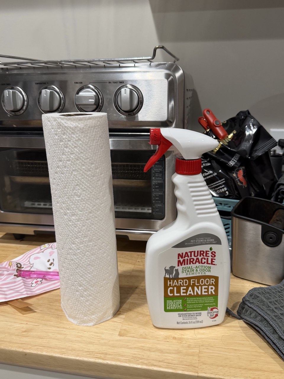 Cleaning spray bottle and paper towel roll